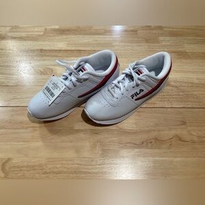 Fila sneakers in size 8 1/2. White in color. NWT. Brand new & never worn